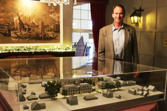 Sandilands hotel owner Tim Cross with the Â£7,000 to-scale model which showcases the proposed plans for the Â£8.5m complex.