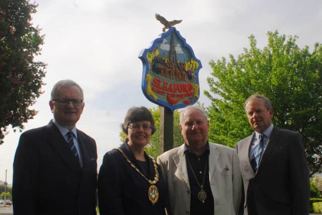 The repainted Sleaford town sign on Lincoln Road with the new eagle to mark 100 years of the RAF and its close association with the town. Unveiled by, from left - Christopher Hodgson (vice-chairman of Sleaford and District Civic Trust), Coun Sally Tarry, chairman of NKDC, Coun Anthony Brand, Deputy Mayor of Sleaford, and Garry Titmus, chairman of Sleaford and District Civic Trust. EMN-180515-100317001