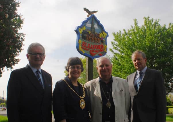 The repainted Sleaford town sign on Lincoln Road with the new eagle to mark 100 years of the RAF and its close association with the town. Unveiled by, from left - Christopher Hodgson (vice-chairman of Sleaford and District Civic Trust), Coun Sally Tarry, chairman of NKDC, Coun Anthony Brand, Deputy Mayor of Sleaford, and Garry Titmus, chairman of Sleaford and District Civic Trust. EMN-180515-100317001