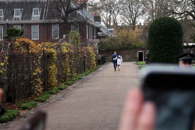 Rich Dutton's image of the Royal couple walking away is appearing in a new book on the wedding. EMN-180514-172048001
