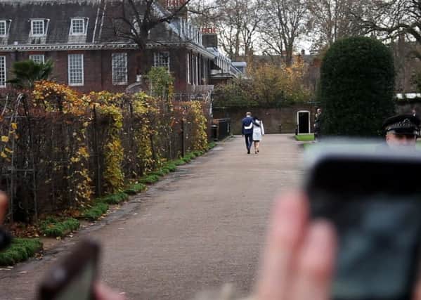 Rich Dutton's image of the Royal couple walking away is appearing in a new book on the wedding. EMN-180514-172048001