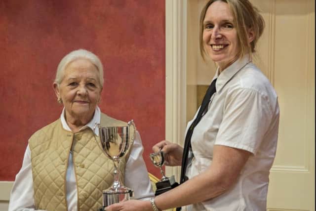 Sarah Vowles, (right), receives the Edward Robinson cup from vice president Cecile Large.