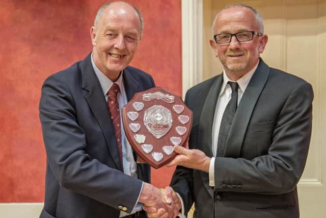David Boorer, (right), receives the Sally Walker sheild from Richard Walker.