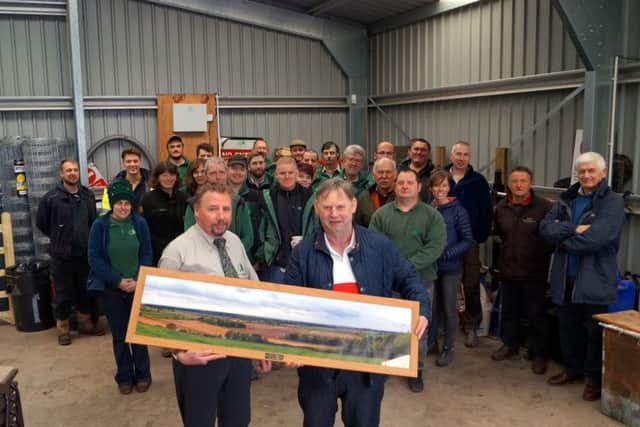 Ray Smith was presented with a photograph of his favourite view by his colleagues at the Forestry Commission. Photo: Dianne Tuckett.