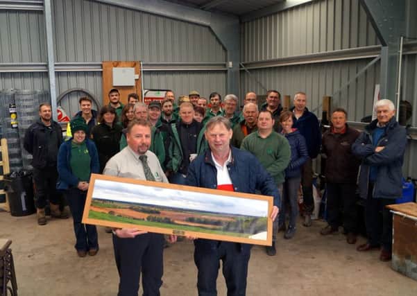 Ray Smith was presented with a photograph of his favourite view by his colleagues at the Forestry Commission. Photo: Dianne Tuckett.
