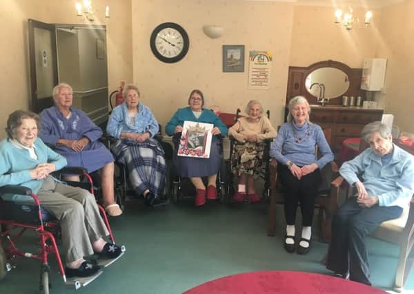 Oakdene residents with their wedding congratulations card for Meghan and Harry. From left - Mary Graves, Annie Young, Joyce Moyses, Kathleen Olsen, Gladys Harrison, Joyce Dodsworth and Brenda Smith. EMN-180514-163801001