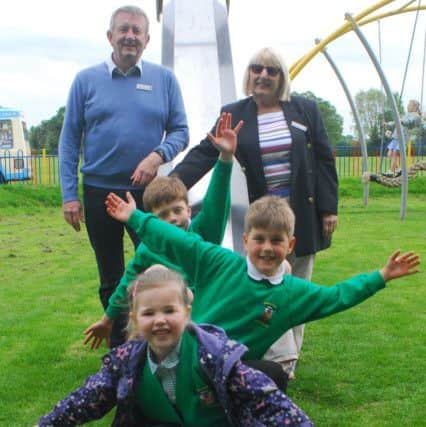 Officially opening Metheringham's refurbished play park - parish council vice-chairman Nick Byatt and chairman Sally Wilson with colouring and poem competition winners George Pearse, James Roland and Skyler-May Ford. EMN-180515-095050001