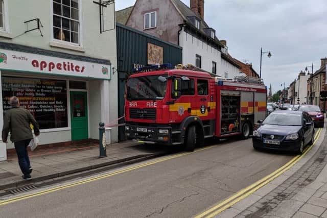 Joe Carrigan's photo of the Bristol Arcade cordoned off in Sleaford on Sunday morning while they worked to free a trapped duck from roof netting. EMN-180514-091749001