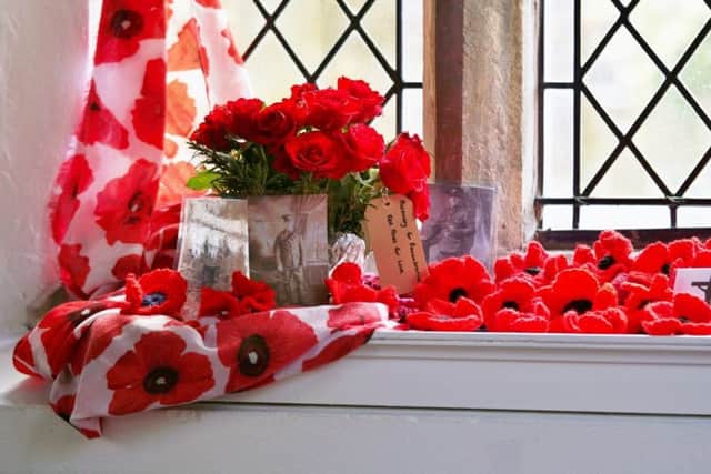 Rosemary for Remembrance and red roses for love: one of the  window displays at Middle Rasen Church. Picture by Angela Mayne