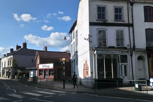 Change of use application to listed building. Picture: white derelict building on corner.