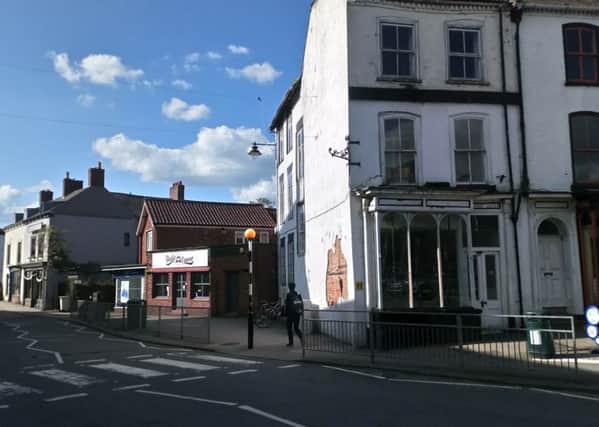 Change of use application to listed building. Picture: white derelict building on corner.