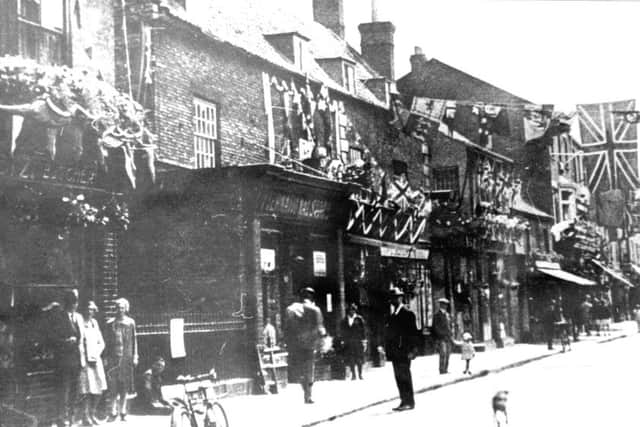 A Southgate street scene from around a century ago - possibly around the time of a coronation celebration. EMN-180519-103051001