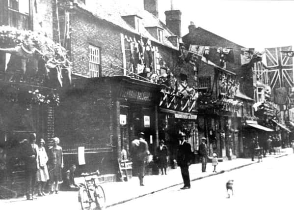 A Southgate street scene from around a century ago - possibly around the time of a coronation celebration. EMN-180519-103051001