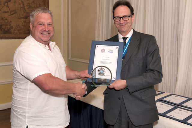 Snow hero - Darren Walker, fo Metheringham receives his award for non-emergency services individual. EMN-180518-140424001
