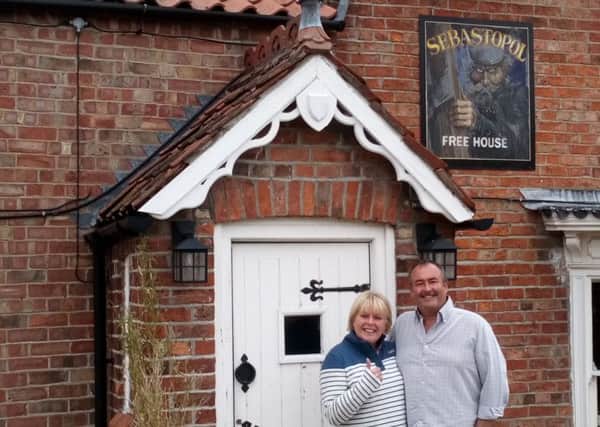 A warm welcome: New owners  Steve and Wendy Hughes  outside the Sebastolpol Inn which will open tomorrow (Thursday).