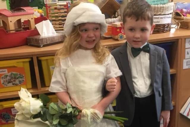 The bride and groom. Youngsters at Brant Broughton Pre-school dressed up for a pretend Royal Wedding at church, with reception children from the village primary school children as guests on Friday. EMN-180520-123955001