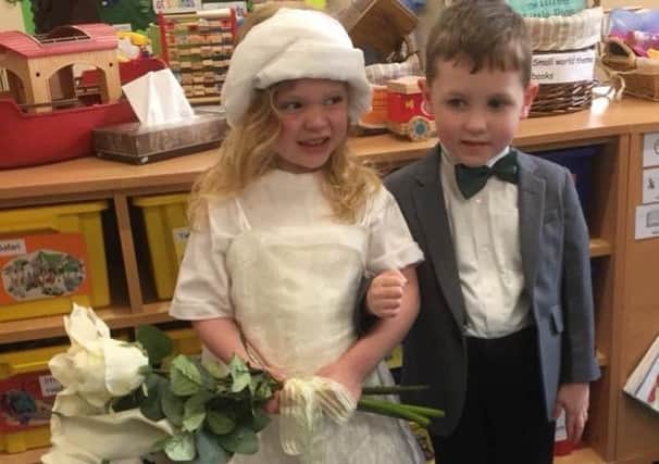 The bride and groom. Youngsters at Brant Broughton Pre-school dressed up for a pretend Royal Wedding at church, with reception children from the village primary school children as guests on Friday. EMN-180520-123955001