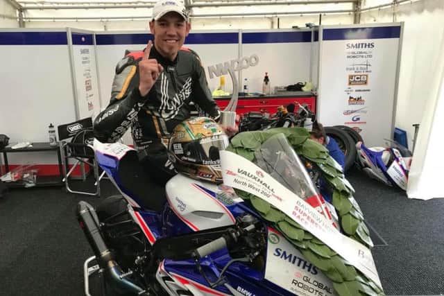 Hickman celebrates his maiden win at the North West 200 as he warms up for the Isle of Man TT EMN-180521-090012002