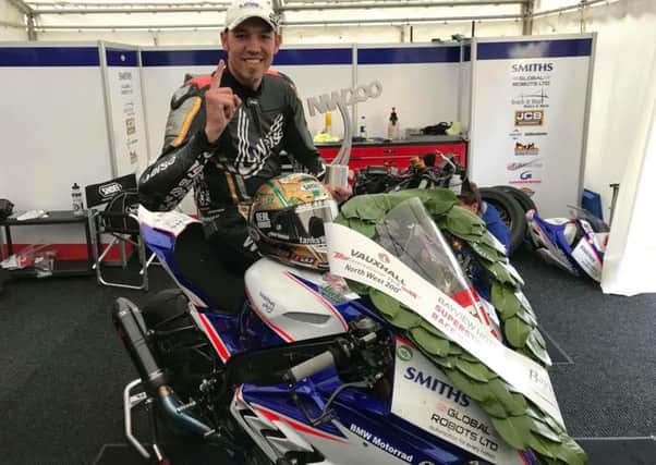 Hickman celebrates his maiden win at the North West 200 as he warms up for the Isle of Man TT EMN-180521-090012002