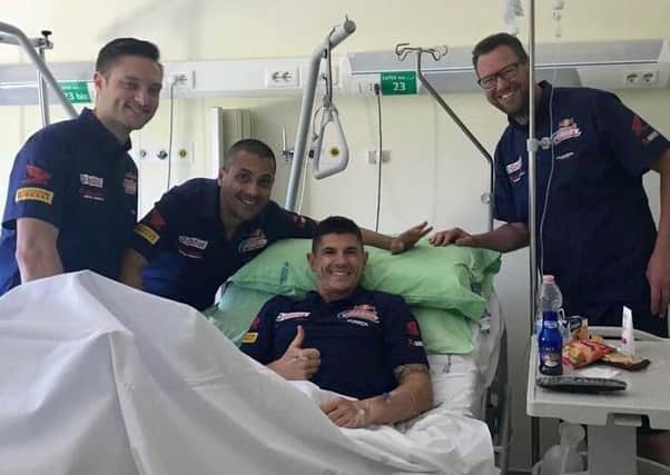 Rasen-based Aussie Jason OHalloran gives fans the thumbs up from his hospital bed EMN-180521-131153002