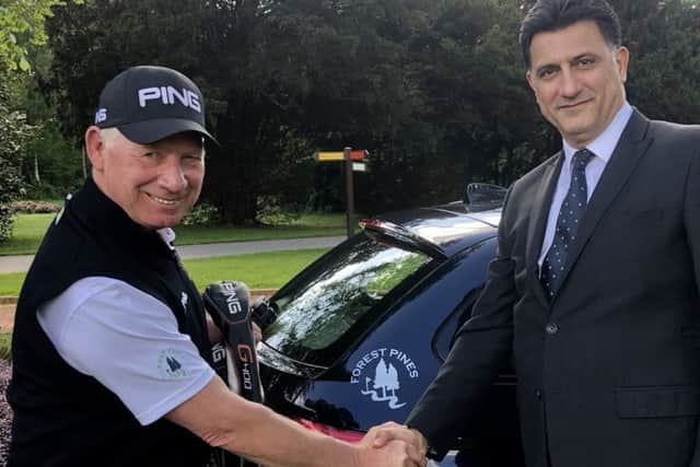 Trick shot maestro David Edwards with Forest Pines general manager Michael Lavizani EMN-180521-163034002