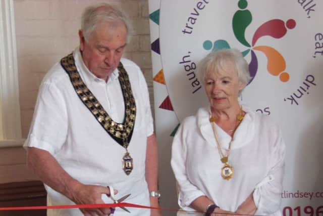 Coun Brian Burbidge cuts the ribbon at the official opening event.