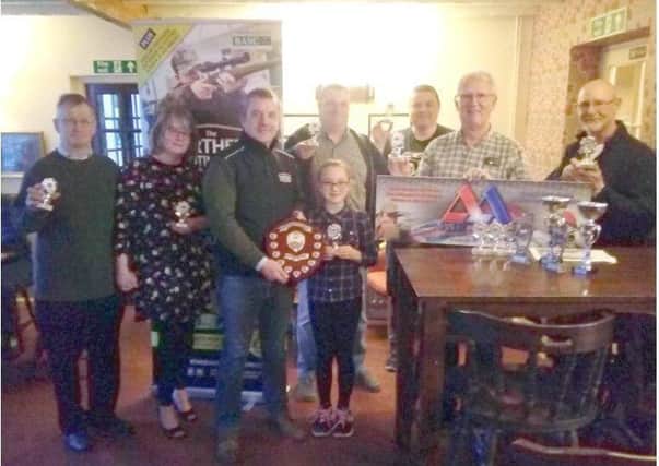 Paul Whitlam MD Northern Shooting Show presented the League Shield to Amy Chapman, watched by other trophy winners EMN-180522-131540001