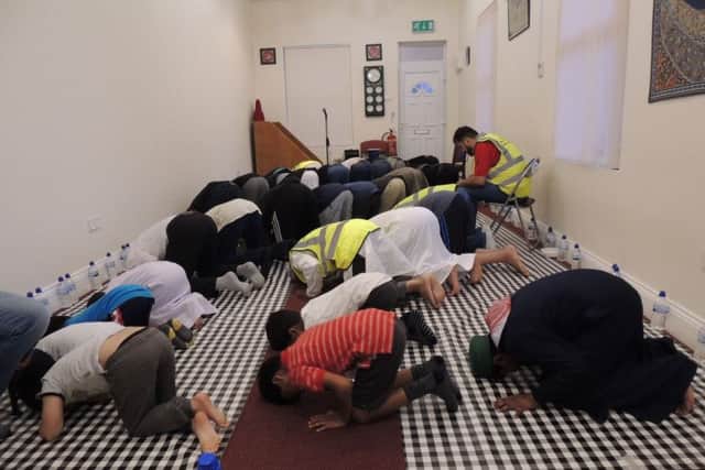 Prayers before the breaking of the fast for Ramadan at Sleaford Mosque when guests were invited to join worshippers for their feast. EMN-180523-164322001