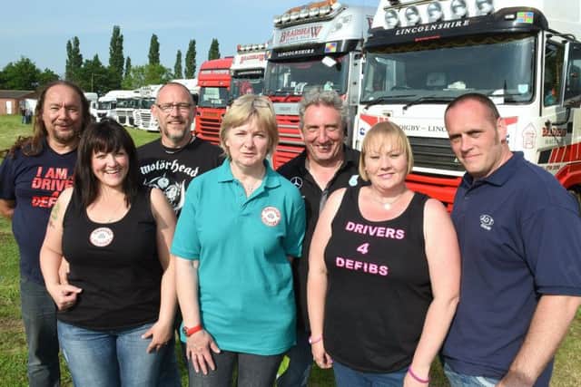 Drivers 4 Defibs at their fun day at Billinghay. Organisers, from left - Dennis Darmon, Rebecca Bradshaw, Fred Bradshaw, Sally Donner, Neil Donner, Louise Couling and Dan Couling. EMN-180524-231723001