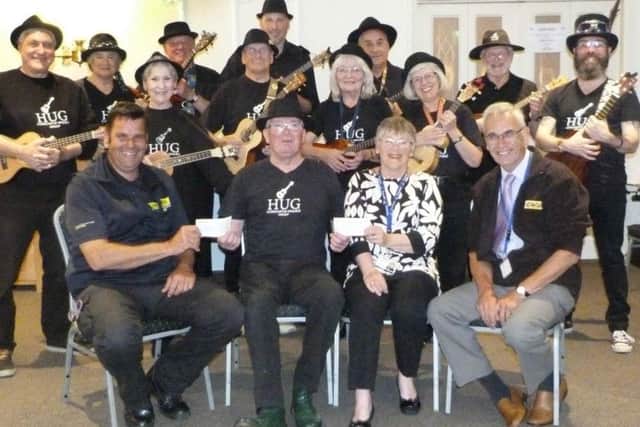 Members of Horncastle Ukulele Group presented a cheque to representatives from LIVES and Lincolnshire and Nottinghamshire Air Ambulance. EMN-180528-104836001