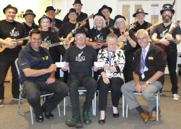 Members of Horncastle Ukulele Group presented a cheque to representatives from LIVES and Lincolnshire and Nottinghamshire Air Ambulance. EMN-180528-104836001