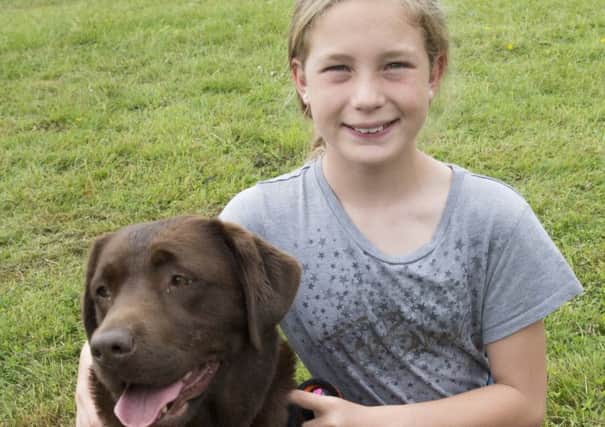 Laurel Mountain, 11, with dog Elsie at the Happy Dog Forever dog show in Leasingham

Picture: Sarah Washbourn
www.yellowbellyphotos.com NNN-180206-195418002