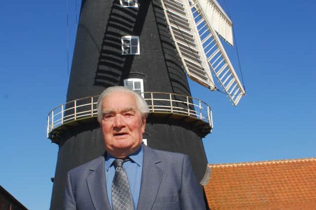 Brian Hubbert in front of Heckington Windmill after his surprise birthday reunion. EMN-180525-004126001