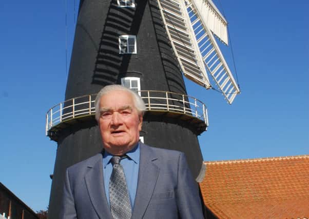 Brian Hubbert in front of Heckington Windmill after his surprise birthday reunion. EMN-180525-004126001