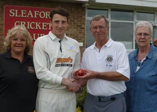Sleaford skipper Tom Shorthouse is pictured with Sleaford and District Lions' John Kyte, Sue La Roche and Pat Clarke after they recently sponsored a match ball.