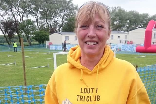 Ros Jackson picks up her age group winners' trophy at Skegness EMN-180525-102129002