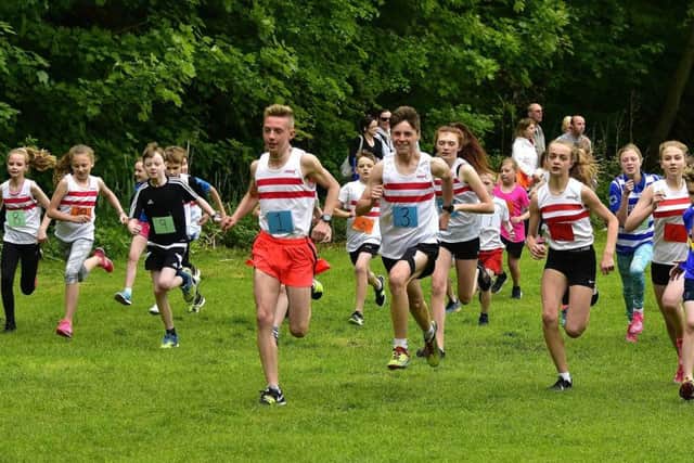 Louth juniors (pictured in white vests with red hoops at the Wolds Dash) excelled on the county stage EMN-180525-112244002
