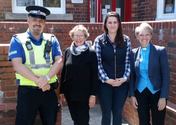 PSCO Nigel Wass with volunteers Chris Ivett, Kay Burge amd the Rev Sam Parsons outside the Community Centre