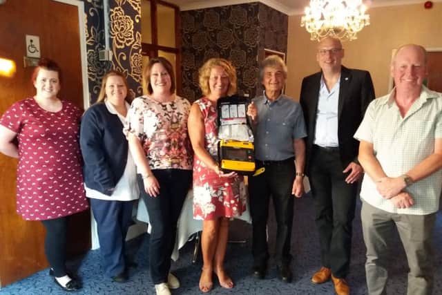 The presentation of a defibrillator to the Fishtoft Playing Fields Trust by the Pilgrim and Heart Fund.