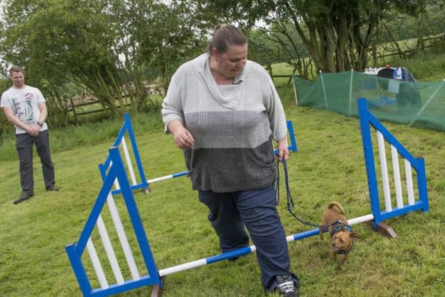 Donna Hemmings from Folkingham with her dog Tiny, trying out the agility course at the Happy Dog Forever dog show in Leasingham
Picture: Sarah Washbourn
www.yellowbellyphotos.com NNN-180206-195344002