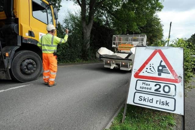 Road dressing works. EMN-180406-152913001