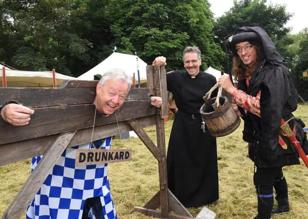 Knights of Skirbeck at Quarrington church. L-R Peter Lowder in the stocks, Rev Mark Thomson and Dave Bedford. EMN-181106-093959001