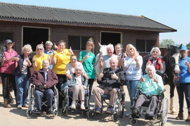 The group of care home residents and staff pictured during their visit to Kesteven Rideability, in Hough on the Hill. Photo by Danielle Rain.