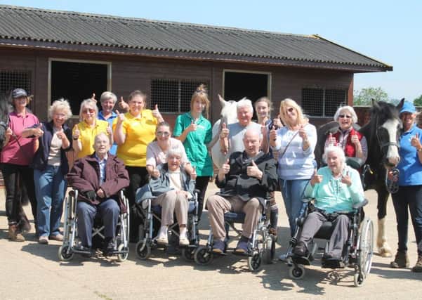 The group of care home residents and staff pictured during their visit to Kesteven Rideability, in Hough on the Hill. Photo by Danielle Rain.