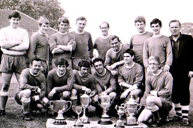 Sleaford Town FC with their cups. EMN-180806-174406001
