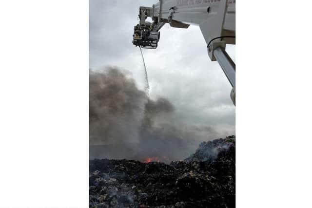 Lincoln's aerial platform at work on the fire at Barkston Heath, near Ancaster. Photo taken by watch manager Karl Turrill of North Hykeham fire station. EMN-180706-132346001