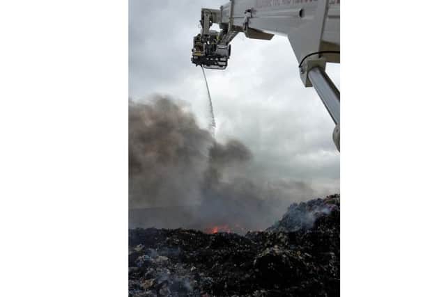Lincoln's aerial platform at work on the fire at Barkston Heath, near Ancaster. Photo taken by watch manager Karl Turrill of North Hykeham fire station. EMN-180706-132346001