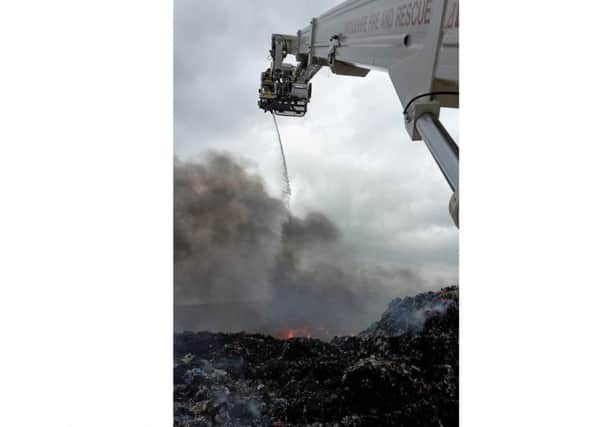 Lincoln's aerial platform at work on the fire at Barkston Heath, near Ancaster. Photo taken by watch manager Karl Turrill of North Hykeham fire station. EMN-180706-132346001