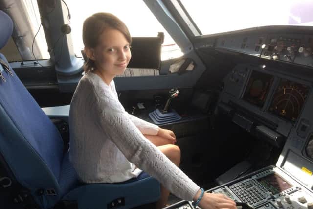 Demi sat in the pilots cockpit between flights on her journey home.