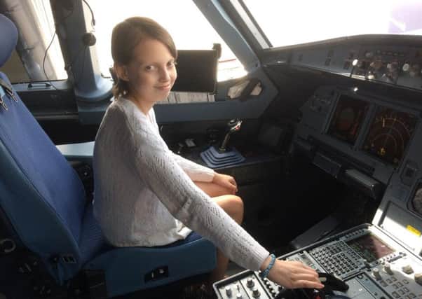 Demi sat in the pilots cockpit between flights on her journey home.